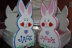 two cardboard easter bunnies sitting next to each other