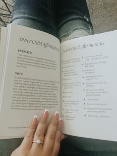 a woman is reading a book about inner child affirmities and how to use it