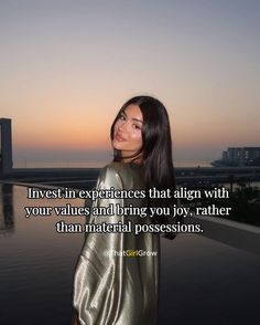 a woman standing in front of a body of water with the words invest experiences that align with