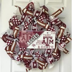 a football wreath with the team's name on it