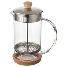 a glass coffee pot with a wooden lid