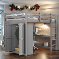 a loft bed with stairs and desk in the middle is decorated for christmas or new year's eve