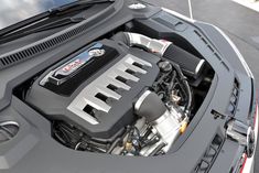 the engine compartment of a car with its hood open