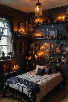 a bed sitting in a bedroom next to a window with candles on the shelves above it