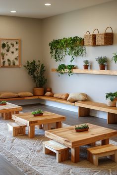 a living room filled with lots of wooden furniture and plants on the wall above them