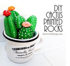 a ceramic cactus sitting in a cup with rocks on the side and text overlay reading diy cactus painted rocks