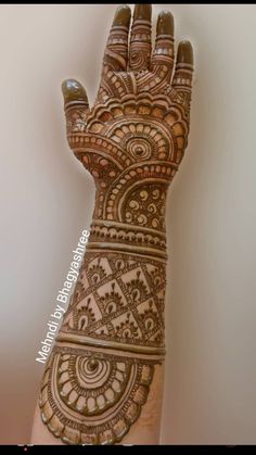 the hand is decorated with intricate designs