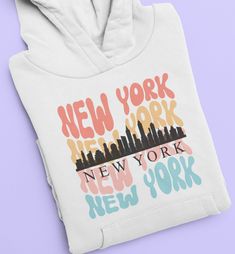 New York Sweatshirt Hoodie, New York Hooded Sweatshirt, NYC Skyline Shirt, New York City Skyline Hoodie, New York Hoodie, Unisex, Plus size too! Cozy sweatshirt (in all the comfort colors) is made from a great 50/50 cotton and polyester blend - it feels so soft, plush and warm! Great for last minute gifts and fans of all things comfortable! Please see our size chart and colors (available colors and sizes may vary, please reach us to find out currently available colors and sizes). With good care, this shirt will last ages and ages and always feel soft.  Please let us know if you have any question before ordering, we will do our best to address your inquiry as quickly as possible. THANKS FOR CHOOSING US! New York City Skyline, New York Sweatshirt, New York T Shirt, Nyc Skyline, Cozy Sweatshirts, City Skyline, Last Minute Gifts, New Yorker, Comfort Colors