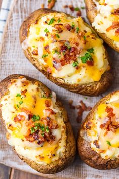 four baked potatoes with cheese and bacon on top