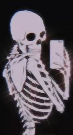 a skeleton holding a cell phone in it's hand