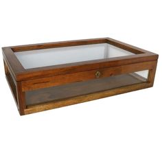 a wooden display case with glass top and bottom shelf on an isolated white background,