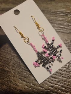 Add a touch of whimsy and nature-inspired elegance to your jewelry collection with our Possum Glam Beaded Dangle Earrings. Handcrafted with meticulous attention to detail, these earrings feature intricately beaded possum designs that dangle gracefully from your ears. Each pair is made with high-quality beads and hypoallergenic hooks, ensuring both beauty and comfort. Perfect for animal lovers and those who appreciate unique, artisanal accessories, these earrings are a delightful addition to any outfit. Whether you're dressing up for a special occasion or adding a playful twist to your everyday look, our Possum Glam Beaded Dangle Earrings are sure to make a statement. Details: *Handmade with love and care *Lightweight and comfortable for all-day wear *Hypoallergenic hooks *Length: [Insert l Whimsical Beaded Earrings With Dangling Beads For Gifts, Whimsical Beaded Dangle Jewelry, Whimsical Adjustable Beaded Earrings, Handmade Whimsical Beaded Drop Earrings, Whimsical Beaded Earrings As A Gift, Whimsical Handmade Beaded Drop Earrings, Whimsical Beaded Drop Earrings, Unique Flower Drop Earrings With Dangling Beads, Whimsical Handmade Beaded Dangle Earrings