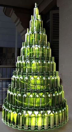 there is a very large christmas tree made out of beer bottles