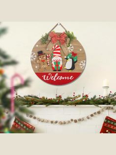 a christmas sign hanging from the side of a fireplace