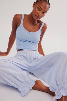 All you need for the sweetest sleep: this essential set from Intimately features a darling ribbed tank with our fav Cloud Nine searsucker bottoms in a jogger style for a put-together look that dreams are made of. **Fit:** Fitted top, relaxed, low-rise bottoms **Features:** Top: Soft ribbed fabrication, scoop neckline, full length, rose applique; Bottoms: Searsucker fabrication, elastic waistband, front patch pocket, ruched leg opening, drop-crotch silhouette **Why We | Cloud Nine Pajama Set by Intimately at Free People in Blue, Size: L Cute Sweats, Embroidered Pajamas, Free People Set, Cute Lounge, Cute Pajama Sets, Rose Applique, Comfy Sets, Lounge Outfit, Cloud Nine