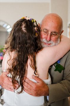 Father Daughter hugs on the brides wedding day