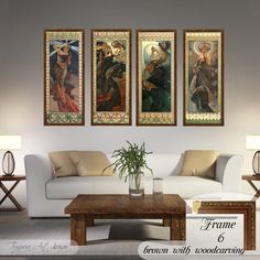 a living room with three paintings on the wall