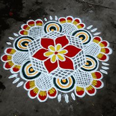 a colorful flower design on the ground