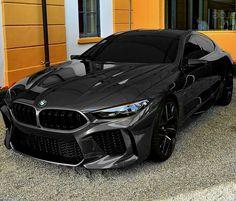 a black sports car parked in front of a building