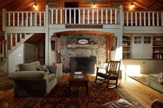 a living room filled with furniture and a fire place