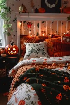 a bedroom decorated for halloween with pumpkins and lights