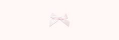 a white bow on top of a light pink background with the word hello kitty written below it