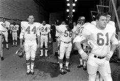 the football players are lined up for their team's first time on the field