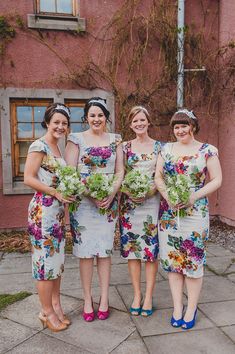 the bridesmaids are all dressed in matching dresses