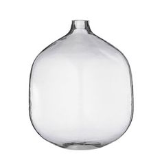 a clear glass vase sitting on top of a white table