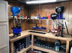 the inside of a garage with shelves and tools