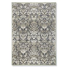 a rug with an ornate design on the front and back of it, in grey tones