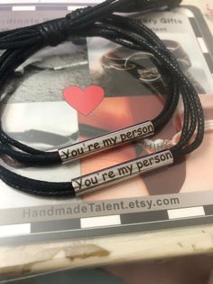 two bracelets that say you're my person