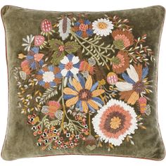 an embroidered pillow with flowers on it