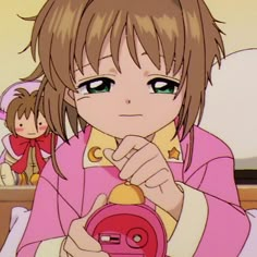 an anime character holding a camera in her hand