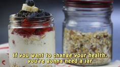 two jars filled with food sitting on top of a table