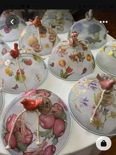 a table topped with lots of plates covered in different designs