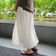 Kigoku Linen Skirt – Cherry Picks Casual Beige Pencil Skirt, Casual Beige Flared Skirt, Casual Flowy Asymmetrical Maxi Skirt, Versatile Long Skirt Bottoms For Day Out, Versatile Long Skirt For Day Out, Casual Solid Color Flowy Wrap Skirt, Versatile Long Skirt With Relaxed Fit, Beige Relaxed Fit Long Skirt, Casual Flowy Wrap Skirt