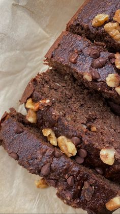 slices of chocolate cake with nuts on top