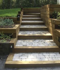 a set of stone steps leading up to a grassy area