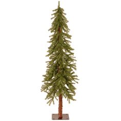 a small pine tree on a stand against a white background