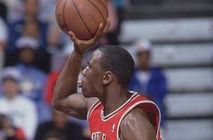 a man holding a basketball in his right hand