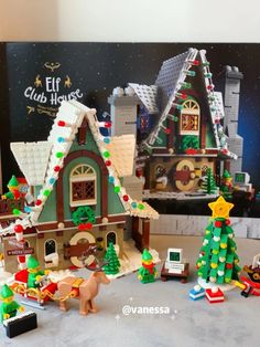 a lego christmas village set is shown in front of a poster