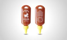 two ketchup bottles with mustard on them