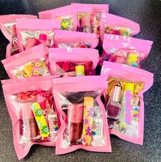 pink plastic bags filled with different types of items