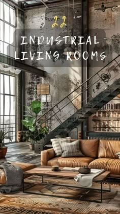 an industrial living room with leather couches and rugs in front of the stairs