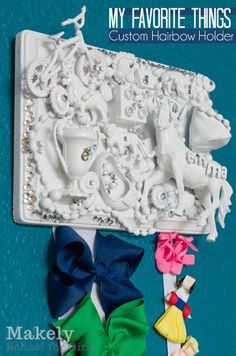 a close up of a toy horse and carriage on a blue background with the words, my favorite things custom hair bow holder