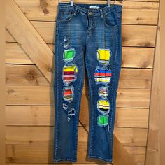 a pair of jeans with colorful patches on them