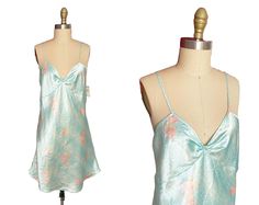 This cute nightgown slip dress is deadstock that has never been warn with original tags! It has adjustable straps tha can shorten or make longer. The tag reads XL but please check meausmrents below. Has kind of a heart shaped pattern with pink roses all over.  Measurements: Bust:39"-40" Waist-39" Hips-46" Length-42.5" Fabric: Polyester  Condition: Great Label: Just Love  💗Follow on Instagram to see videos of items and more! @fashionairevintage https://www.instagram.com/fashionairevintage/ 💗 This Skirt has been hand laundered and ready to wear. PLEASE READ BEFORE BUYING   For the best fit please compare measurements to a garment you own and make sure to measure yourself before you buy. If you are not sure how send me a message! I do not accept returns if the garment does not fit you as ex Green V-neck Nightgown For Sleep, Vintage V-neck Nightgown For Loungewear, Cute Nightgowns, Satin V-neck Summer Nightgown, Blue V-neck Nightgown With Lace Trim, Vintage Pink V-neck Nightgown, Women's Nightgowns, Pajama Robe, Shape Patterns