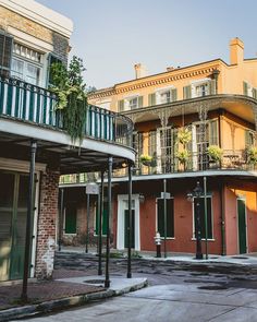 an old building with balconies on the second story