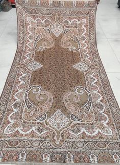 an antique persian rug is on display in a store